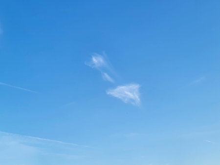 On a nice summer day, the sky is beautiful and blue, with white cirrus cloudsの写真素材