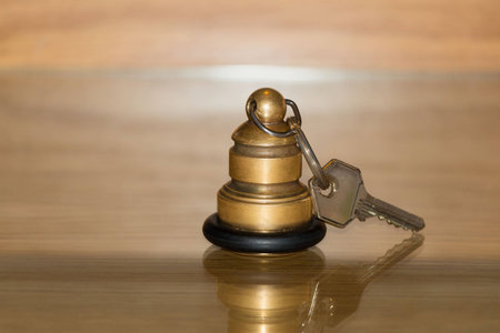 Keyring with key for hotel on the table.の写真素材