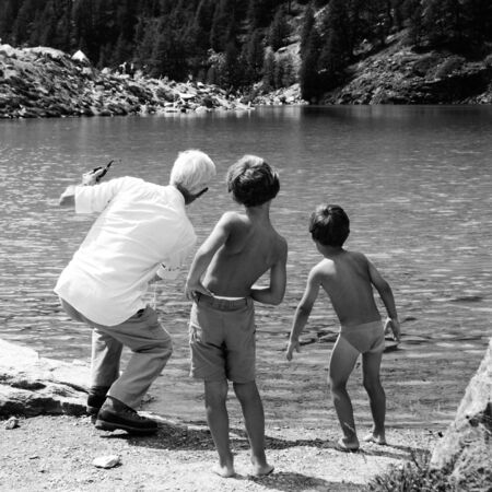 Elderly and young men playingの写真素材