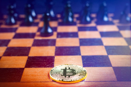 Bitcoin Coin on black background. Bitcoin cryptocurrency. Bitcoin on the chessboardl.の写真素材