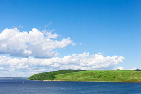 river, forest in summer nature. The sun is shining and the cloudsの写真素材