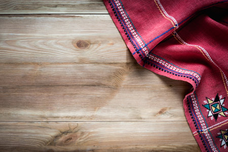 Middle-aged woman working on laptop in cafe, in office. She smiles. Remote workの写真素材