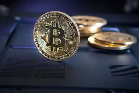 Bitcoin Coin on black background. Bitcoin cryptocurrency on a computer background.
