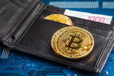 Bitcoin Coin. Bitcoin-crypto-currency on a computer background. Coin in focus.の写真素材