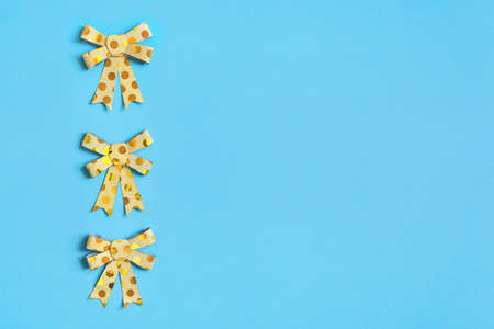 Ribbon bow on blue background as a design element.の写真素材