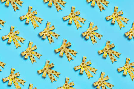 Ribbon bow on blue background as a design element.の写真素材