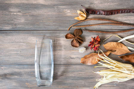 Composition dried colored flowers on wood background. Copy space. Romantic flowers. Place for text...