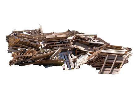 A pile of construction debris made of concrete, wood and metal.
