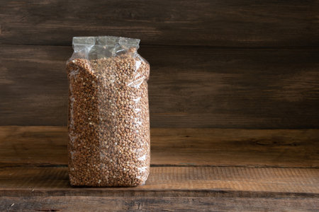 Food in a package on a wooden background. Foodstock conceptの写真素材