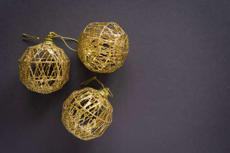 Christmas balls on winter tree branch on dark background.の写真素材