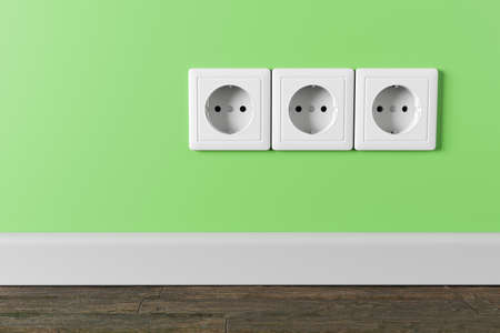 An electrical socket in the wall in the apartment of the house.