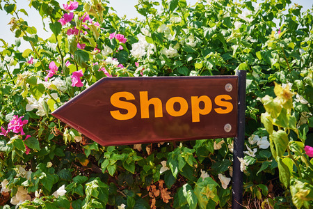 Sign pointing the store in the summer holidays