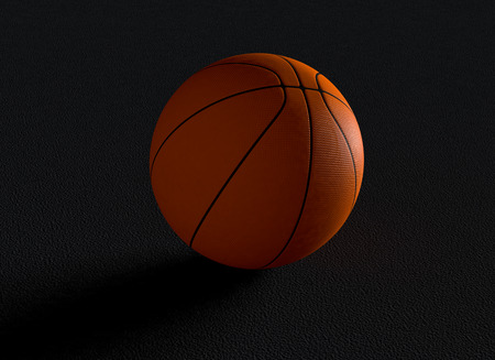 close-up view of a basketball ball on dark background (3d render)の写真素材