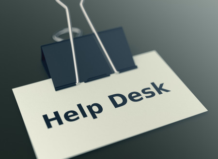 close up view of a paper clip with a business card and text: help desk (3d render)の写真素材