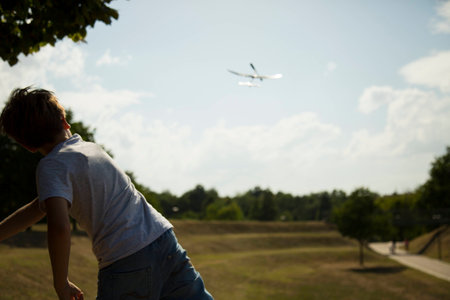 boy launching a model airplaneの写真素材