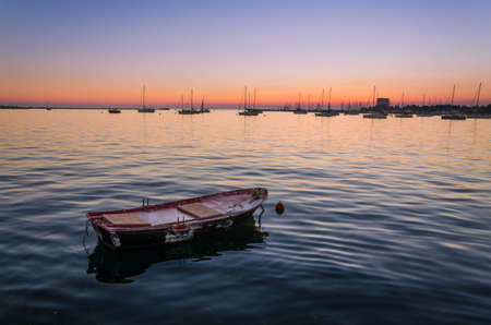 Little rowing boat in the port of Umag