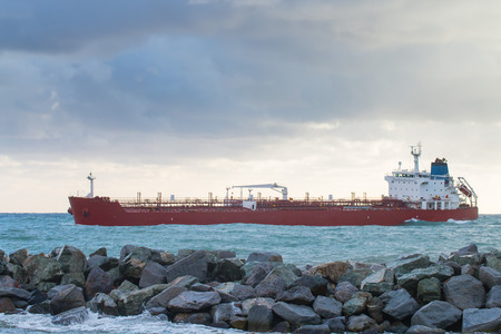 oil chemical tanker  ship arrives in port in a cloudy dayの写真素材