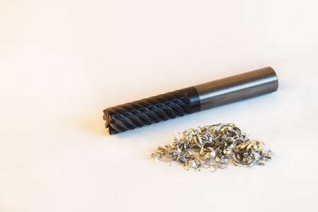 end mill  with aluminium shavings white background horizontal
