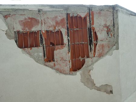 Ceiling Damaged after a weak earthquake, cement plaster and brick have fallen