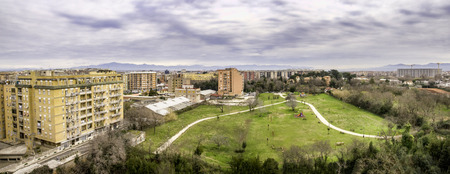 aerial view of a public park and housing in a suburb of Romeの写真素材