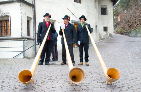 Alphorn players perform in the historic center of Brunicoのeditorial素材