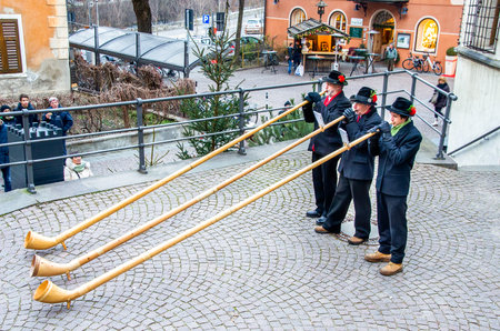 Alphorn players perform in the historic center of Brunicoのeditorial素材