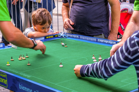 Bologna, Italy, 18 September 2016: A child focusing on a Subbuteo gameのeditorial素材