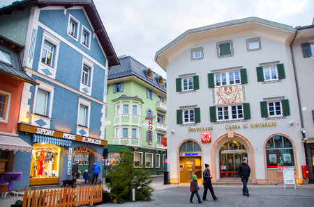 Brunico, Italy, 14 December 2014: family walk through the coloful buildings and shops in the center of the San Candido village during the christmas holidaysのeditorial素材