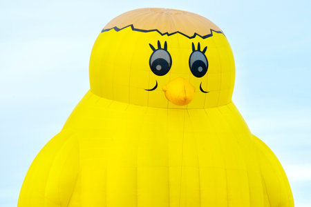Ferrara, Italy 16 September 2016 - giant hot air balloon in the shape of a yellow chick at the Ferrara Balloons Festival 2016のeditorial素材