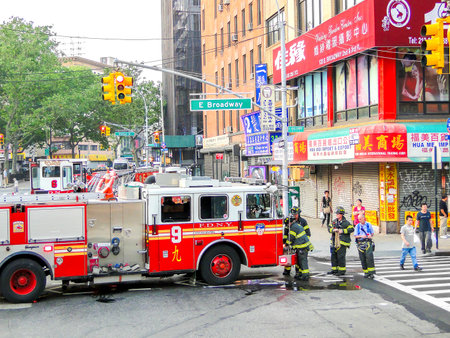 New York, USA, June 2 2011:  FDNY firefighters at work in Chinatown, East Manhattan