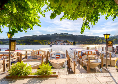 Orta San Giulio, Italy, 21 May 2017 - parked boats on the Orta lake waterfrontのeditorial素材