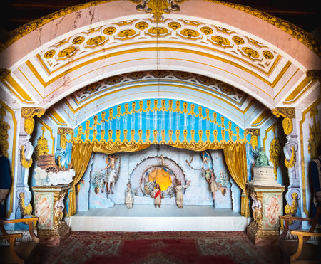 Stresa, Italy, May 22 2017 - an antique puppetry theatre decorated with a golden curtainのeditorial素材