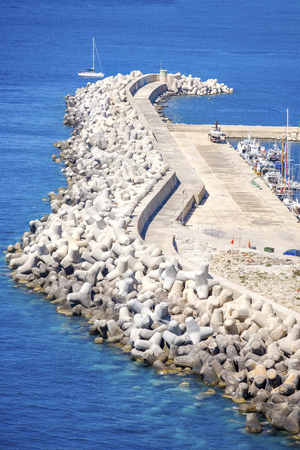 pier breakwater aerial blue transparent clear waterの写真素材