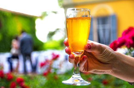 hand stem glass background woman drinking alcohol wine aperitifの写真素材