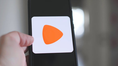 hand use Zalando app on smartphone, Zalando is an european online clothing storeのeditorial素材