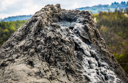 mud volcano or mud dome in Italy, geological phenomenon by eruption of mud, water and methane gasの写真素材
