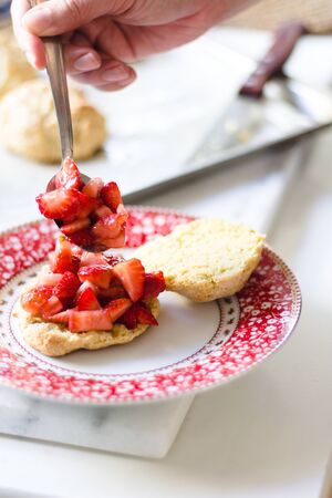 strawberry shortcake with cream on a cute plate.の写真素材