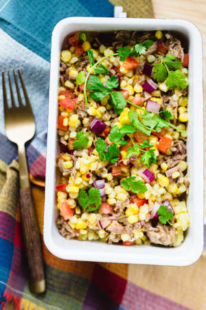Corn salad with beef, tomatoes, red onion and cilantro.の写真素材