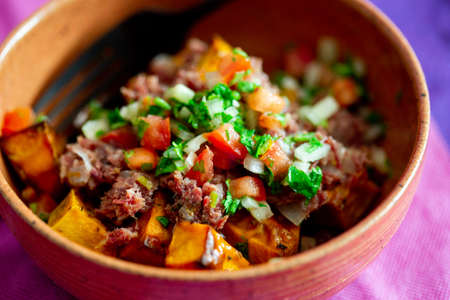 jerked beef with roated butternut squash and pico de gallo salsaの写真素材