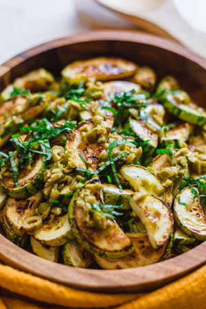 Grilled zuchini with olives and basil.の写真素材