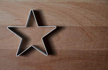 star shaped food ring mold on a wood tableの写真素材