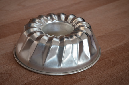 ring cake pan on wood tableの写真素材