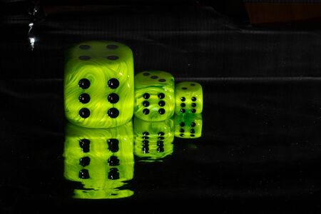 bright green says of different sizes on a black backgroundの写真素材