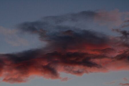 sunset with blue sky and reddish cloudsの写真素材