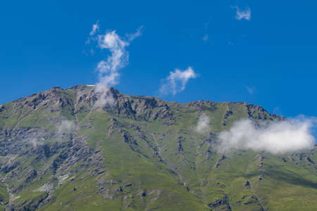 panorama of mountains of piedmont, italy, on a clear day with lots of sunの写真素材