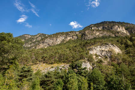 mountain panorama with lush green mountains on a sunny dayの写真素材