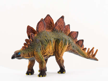 plastic toy dinosaur on white background