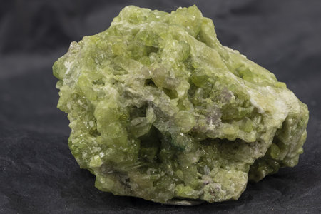 crystals of a green mineral belonging to the class of sorosilicates