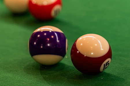 Colorful pool balls arranged on a billiard table, promising entertainment and friendly competitionの写真素材