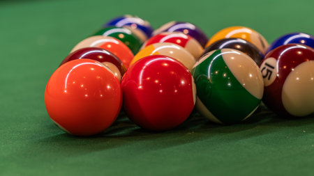 Billiard table setup featuring colorful pool balls, ready for an exciting game of cue sports